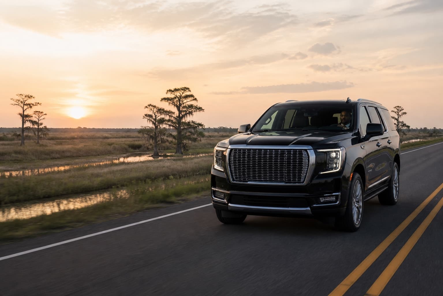 Dominion's black Yukon traveling on a regional Louisiana road